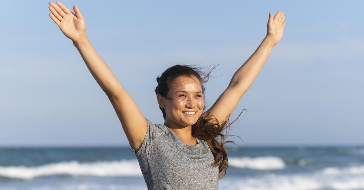 smiley-woman-working-out-beach