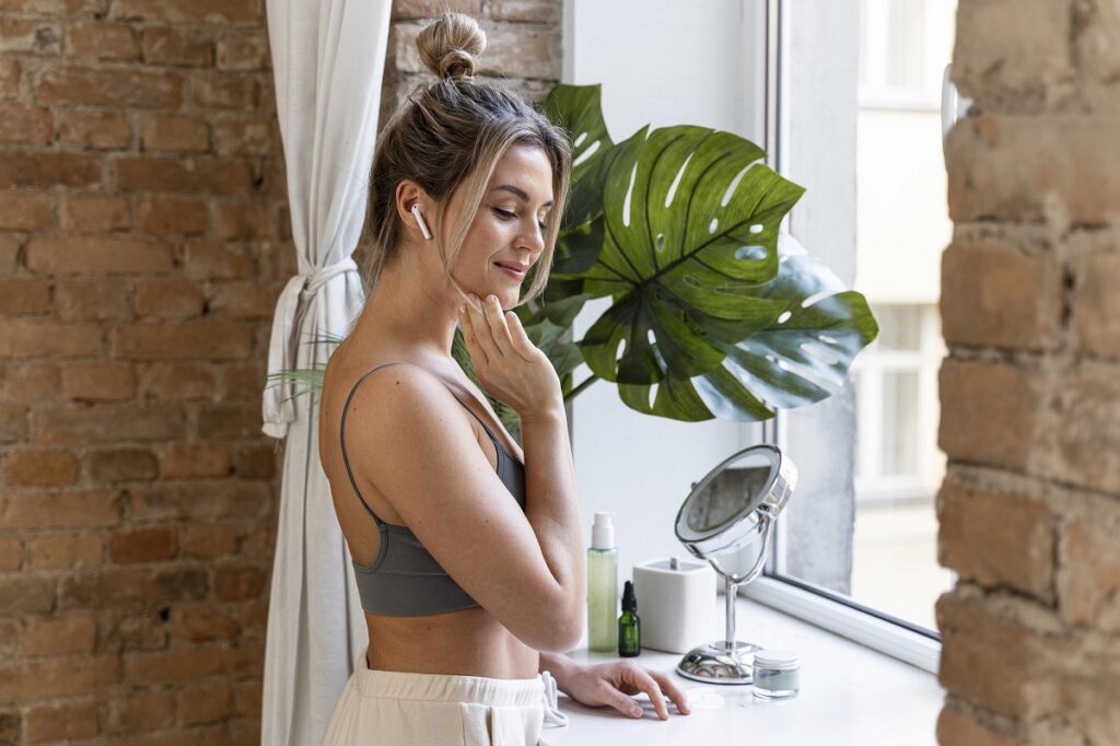 woman listening to music while getting ready in the morning