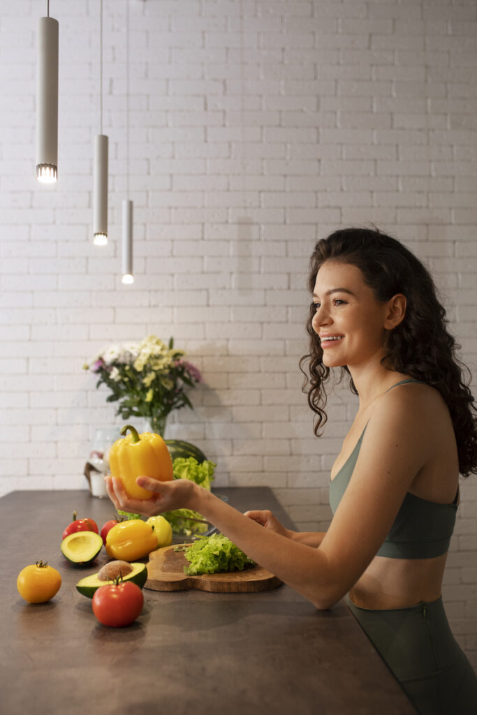 Woman enjoying time at home by making a healthy vegetable salad.